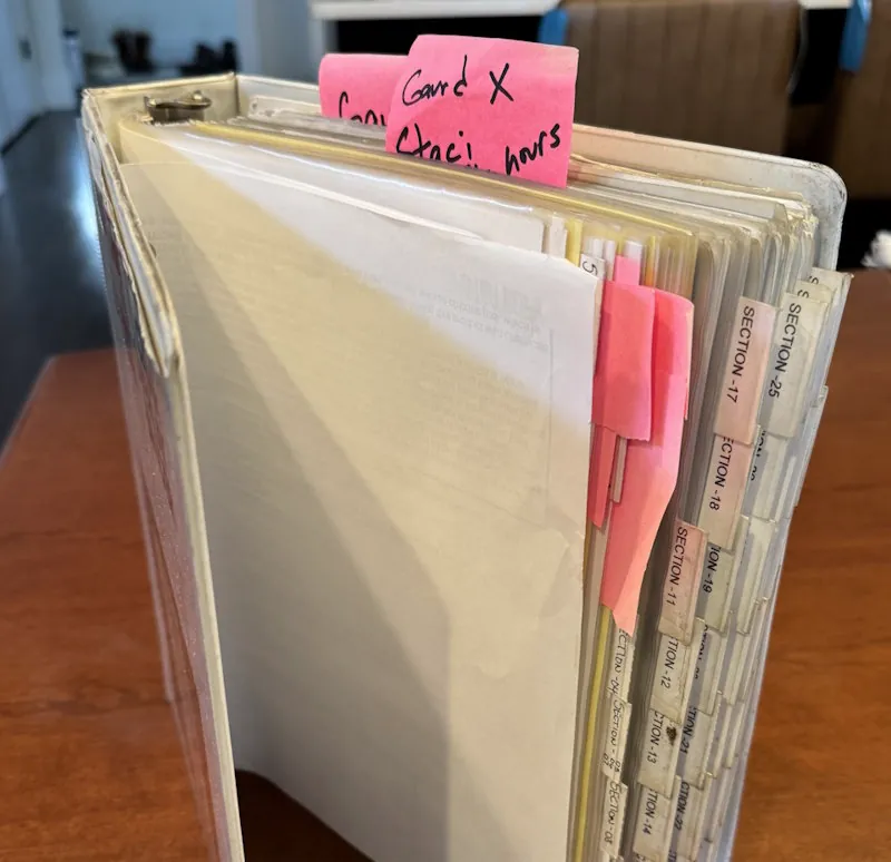 A shelf of outdated policy binders